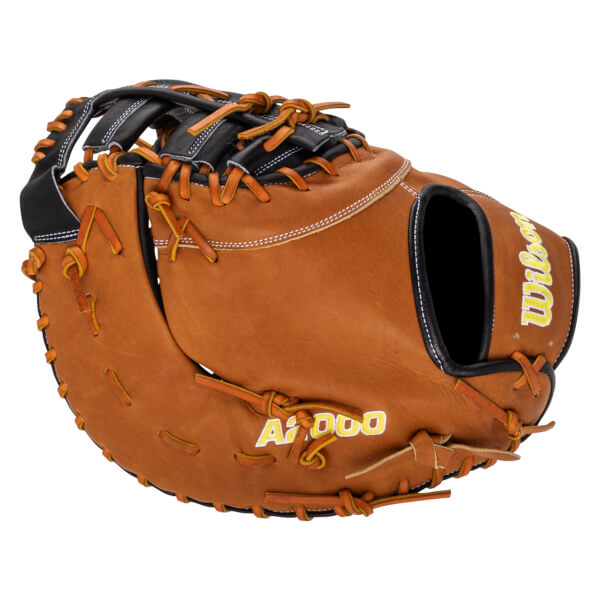 Side view of a brown leather baseball glove with yellow "A2000" and "Wilson" lettering.