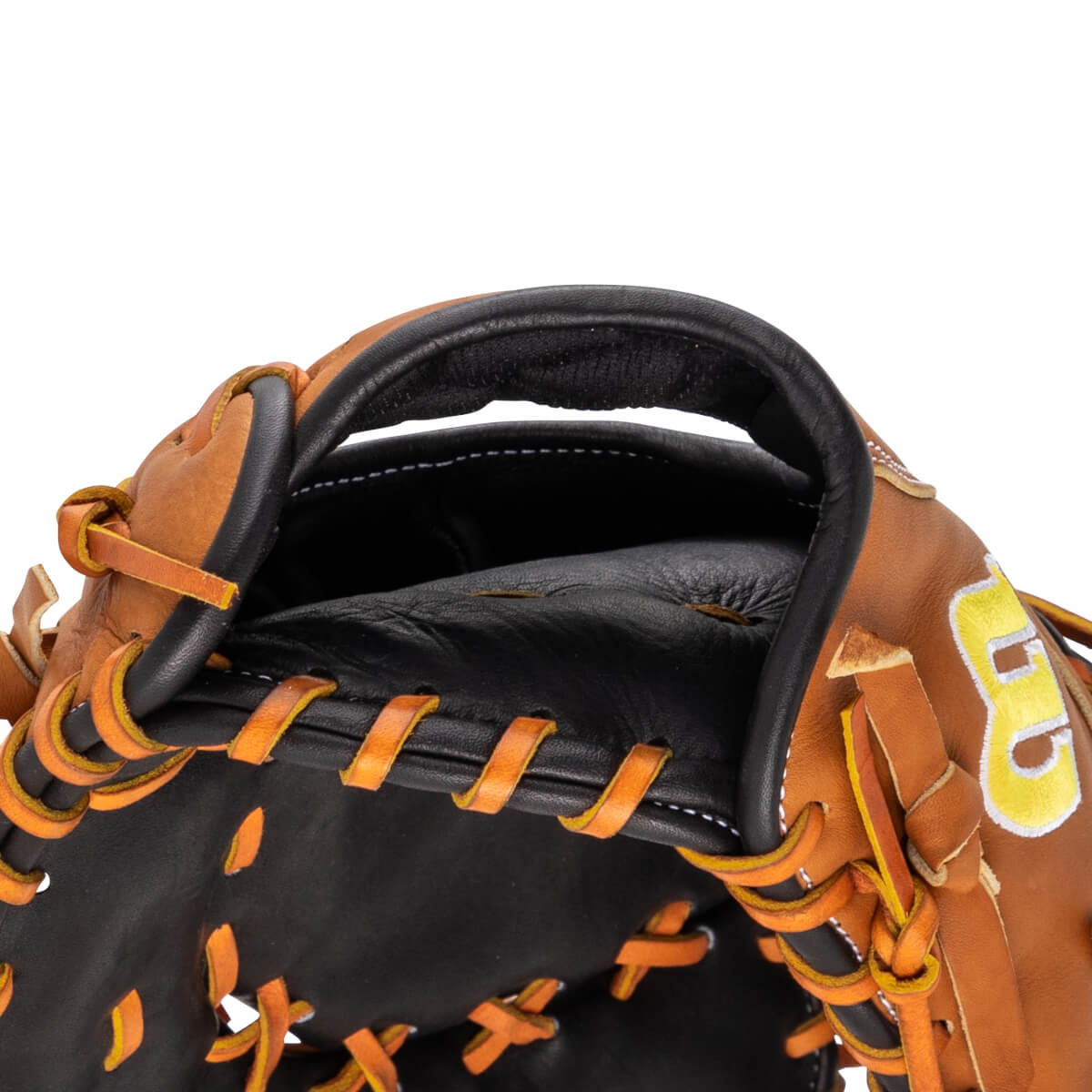Close-up of a brown baseball glove showing the black interior, orange lacing, and a yellow "B" logo.