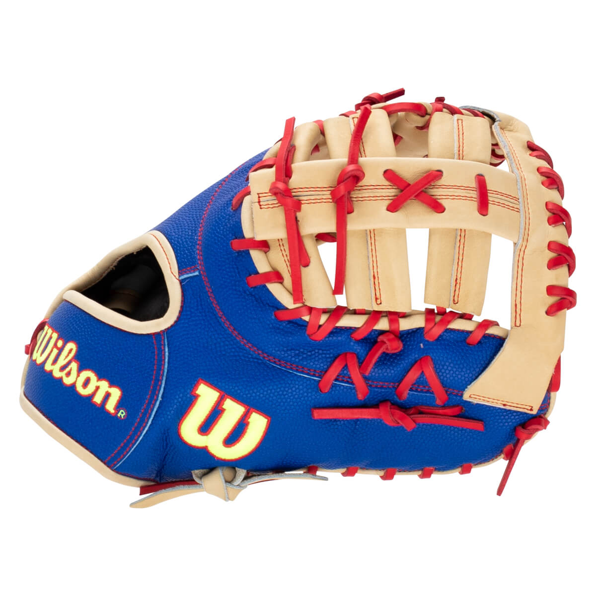 Side view of a royal blue baseball glove with tan webbing, red laces, and yellow Wilson and W logos.