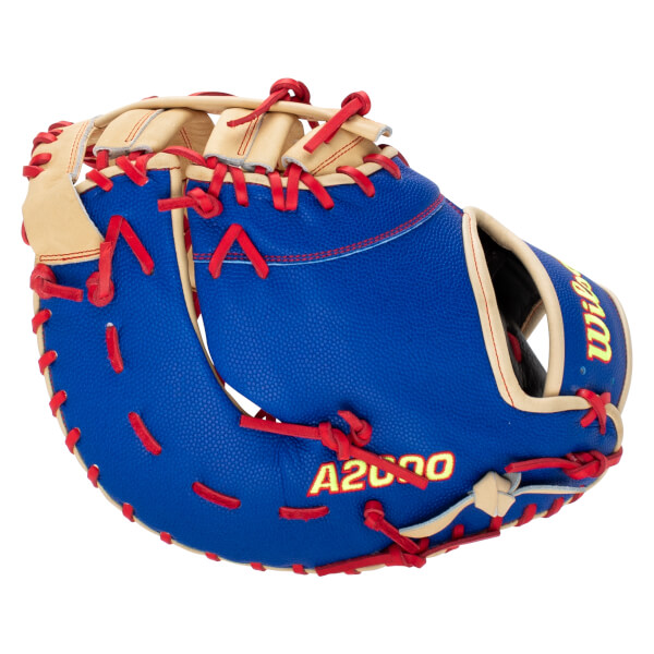 Back view of a royal blue baseball mitt featuring red laces, tan leather trim, and yellow A2000 and Wilson logos.