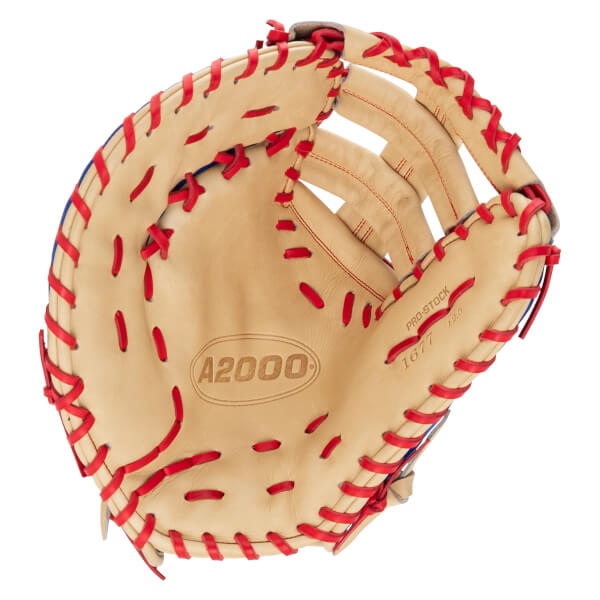 Front view of a tan leather first base mitt with red laces, featuring the A2000 logo in the palm and PRO-STOCK text on the thumb.