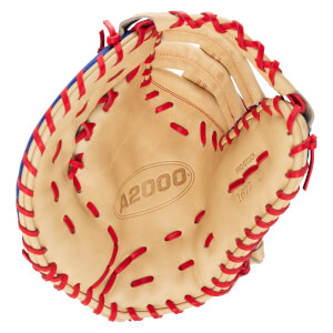 Front view of a tan leather first base mitt with red laces and blue trim, featuring the "A2000" logo and "1677" embossed on the palm.