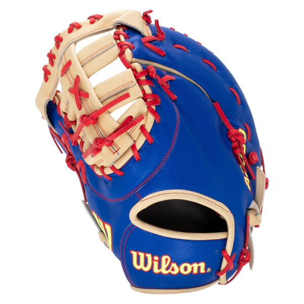 Back view of a royal blue Wilson first base mitt with blonde leather accents, red laces, and a yellow Wilson logo.