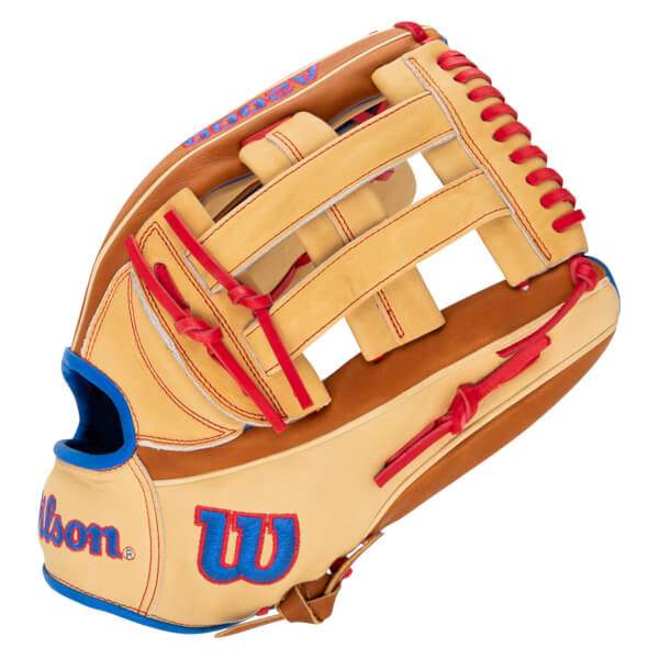 Side view of a tan baseball glove with red lacing, blue trim, and "Wilson" logo.