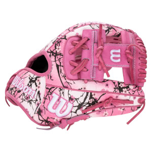 Exterior side view of a pink glove with a black cherry blossom pattern and white "W" and "Wilson" logos.