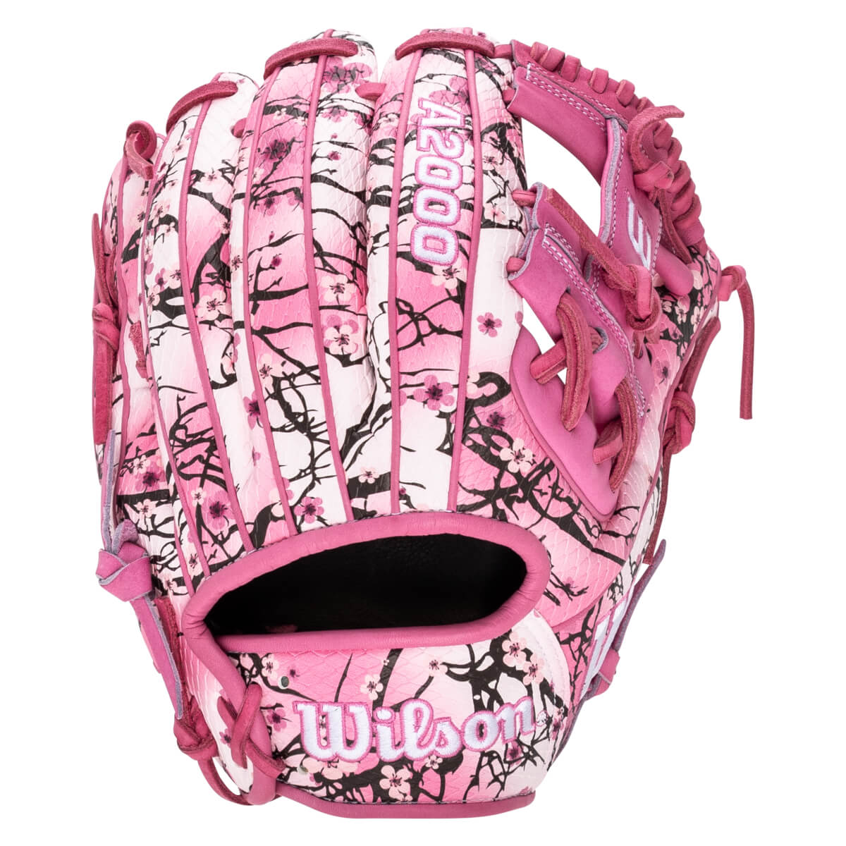 Back view of a pink Wilson A2000 glove featuring a white and black cherry blossom floral pattern with the "A2000" and "Wilson" logos clearly visible.