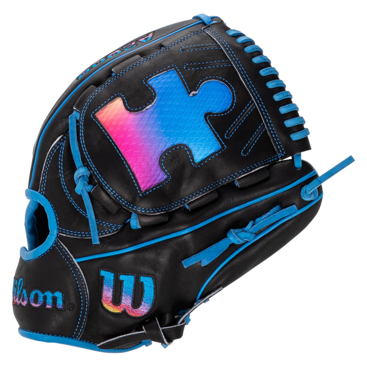 Back view of a black Wilson baseball glove featuring blue lacing and a large pink and blue gradient puzzle piece on the web with a matching Wilson 'W' logo.