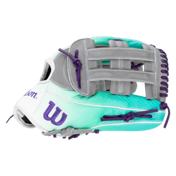 Side view of a white, teal, and gray Wilson baseball glove with purple laces and a large purple "W" logo.
