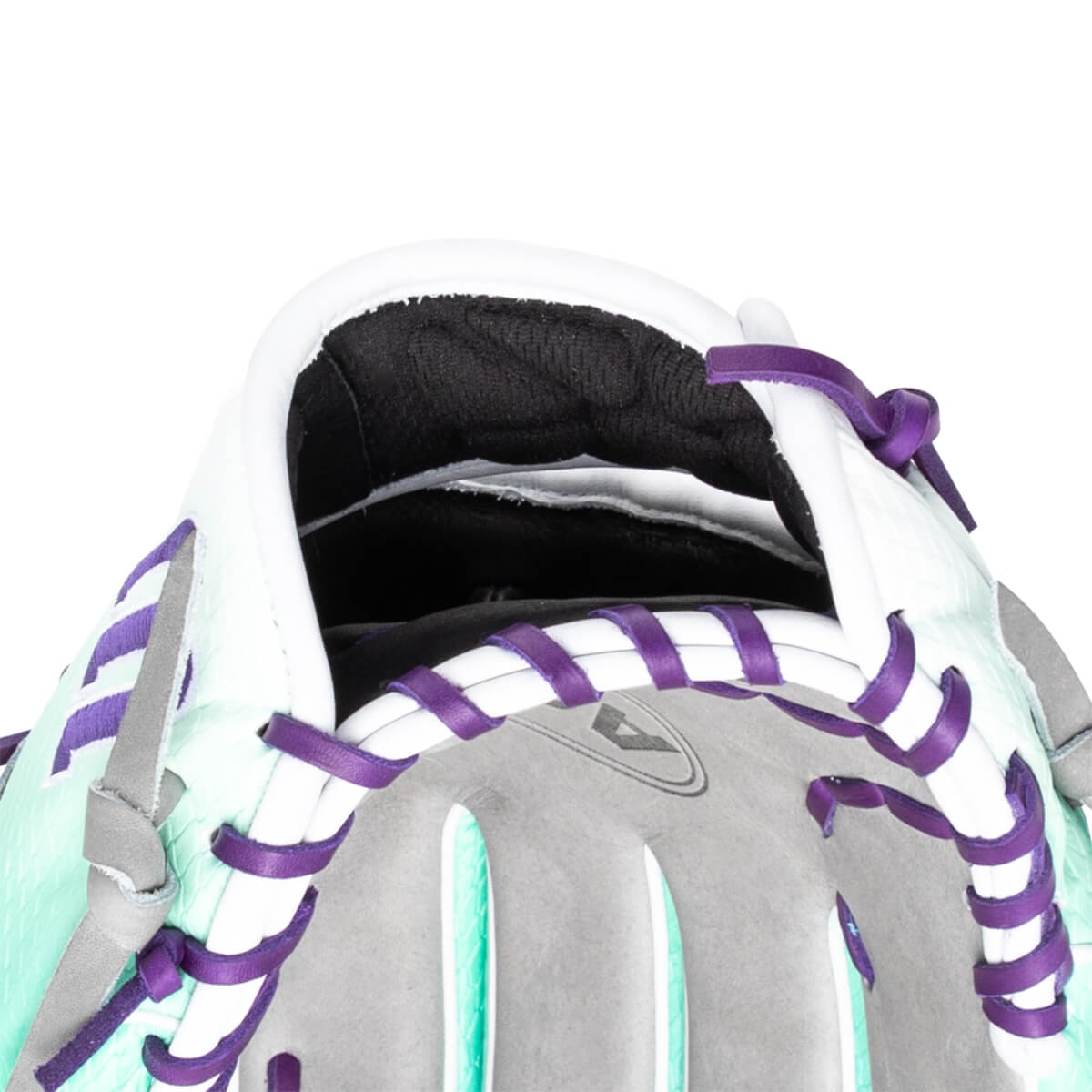 Close-up of the interior of a baseball glove showing white padding, purple lacing, and a textured mint green exterior.