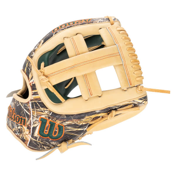 Side view of a tan baseball glove with a camouflage pattern and orange stitching, showing the "Wilson" logo.