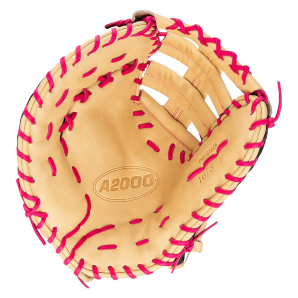 Top-down view of a tan baseball glove with bright pink lacing and "A2000" branding.