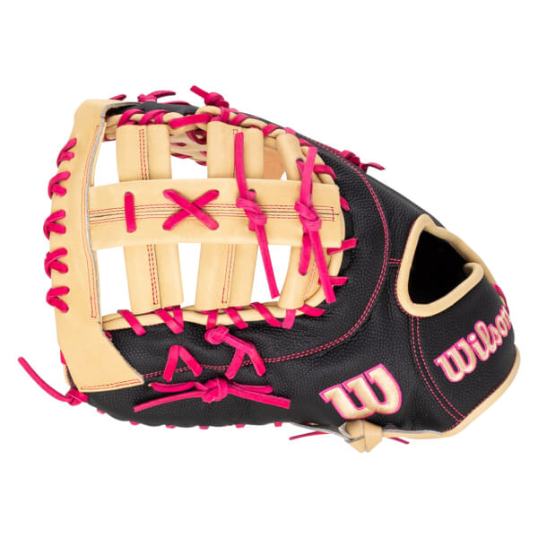 Top-down view of a black Wilson baseball glove with pink lacing and stitching, featuring the "Wilson" logo.