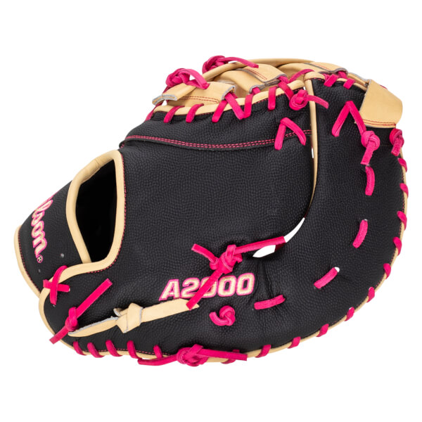 Side view of a black Wilson A2000 baseball glove with tan accents and bright pink lacing.