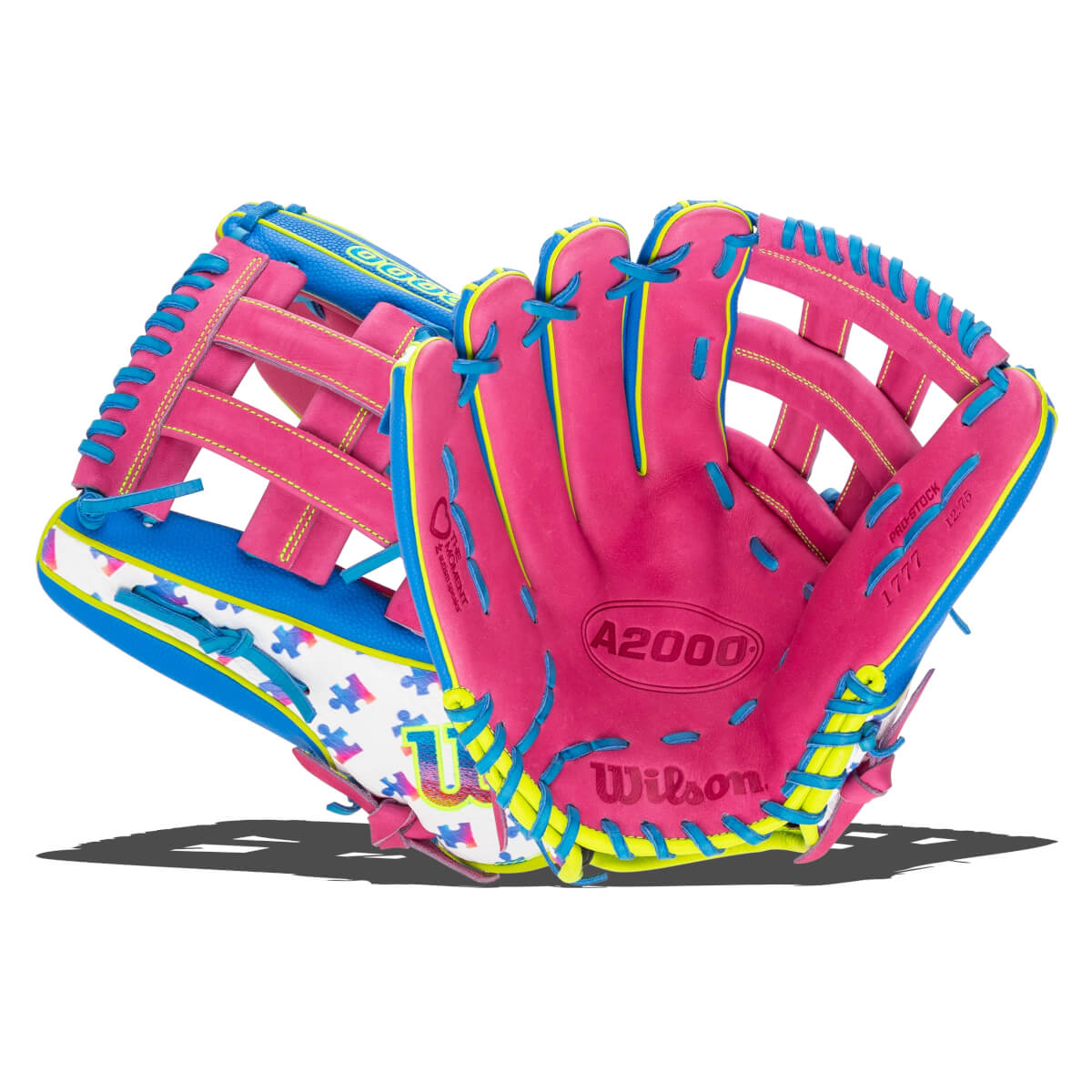 Front view of a pink and blue Wilson A2000 glove featuring yellow laces, a puzzle piece pattern on the wrist, and "A2000" and "Wilson" branding on the palm.