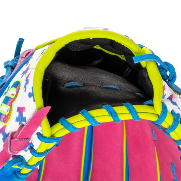 Top-down view looking into the hand opening, showing the black interior, lime green trim, blue laces, and pink leather stalls next to a colorful "W" logo and puzzle pattern.