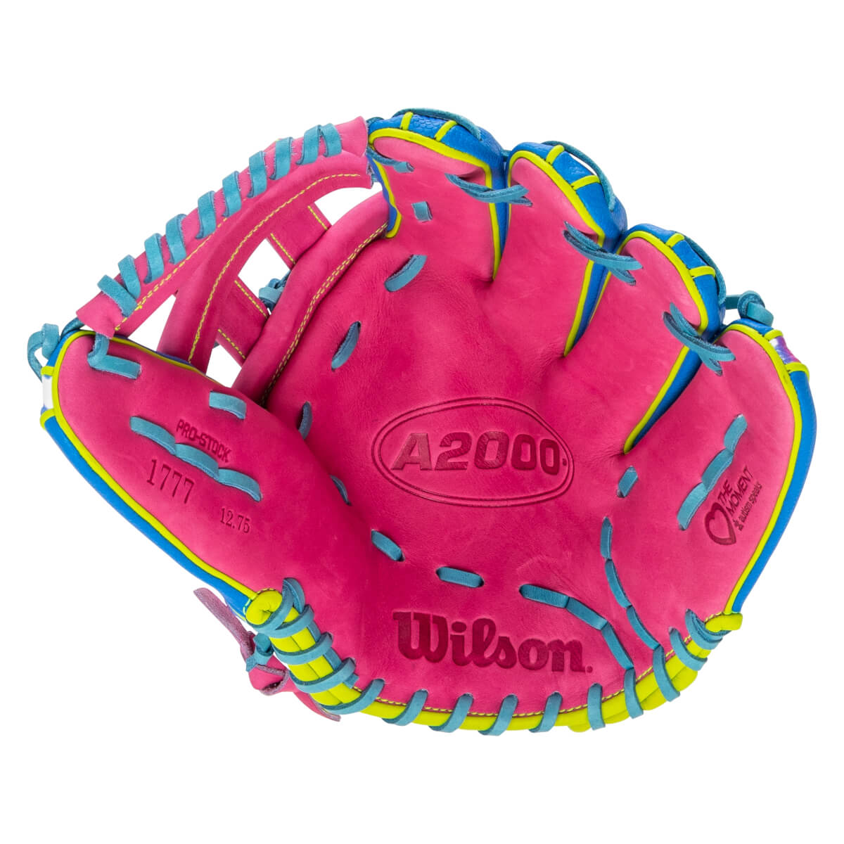 Front view of the pink Wilson A2000 baseball glove featuring light blue laces, "A2000" and "Wilson" branding, and a "The Moment" logo with yellow and blue accents.