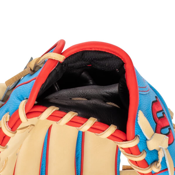 Close-up of a blue baseball glove with red trim and tan lacing, showing the interior pocket.