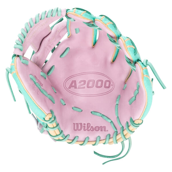 Top-down view of a pink baseball glove with teal and tan lacing, showing the "A2000" and "Wilson" logos.