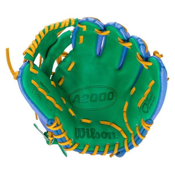 Front view of a green and blue baseball glove with yellow laces, featuring "Wilson," "A2000," and "Love The Moment" text on the palm.