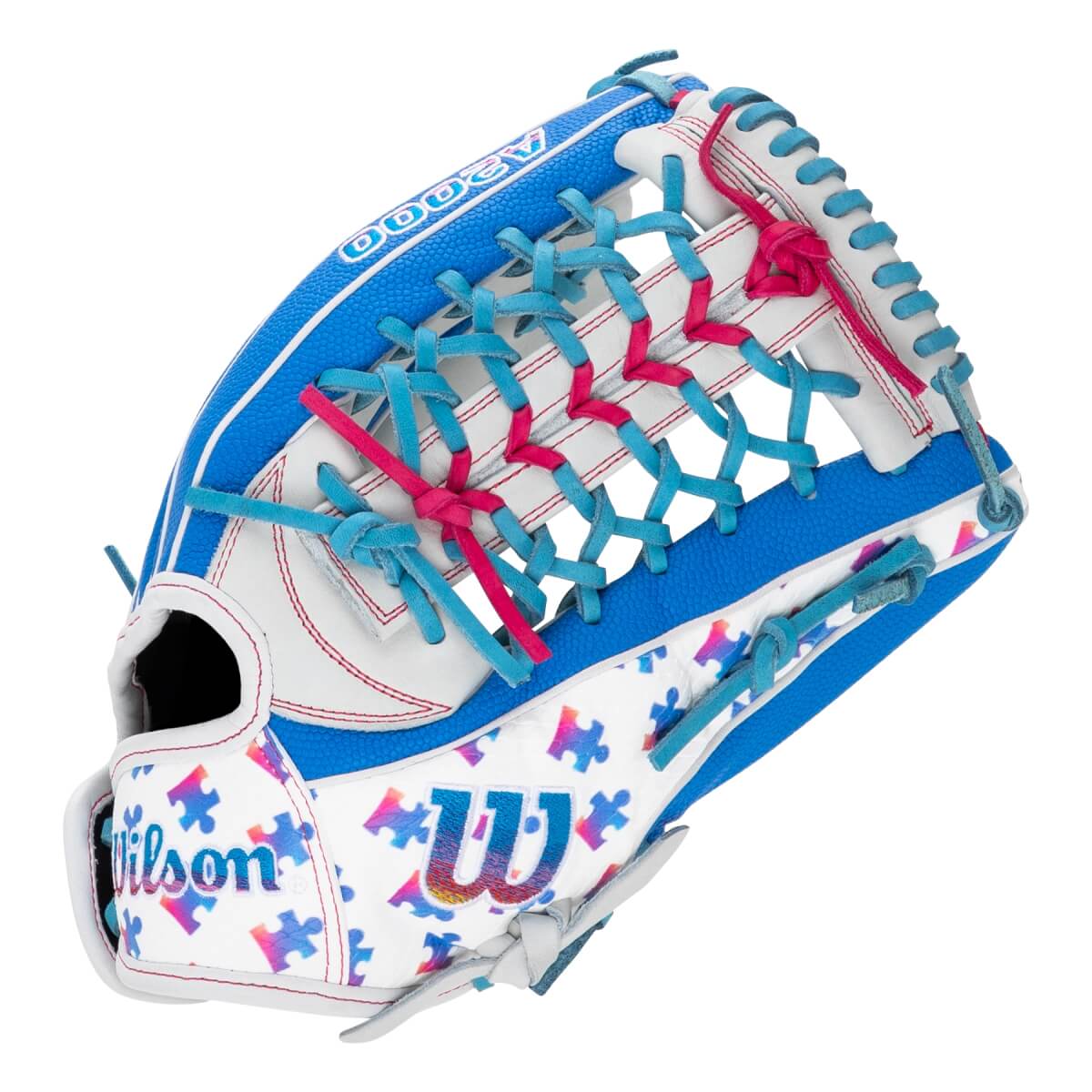 Back view of a white and blue Wilson A2000 softball glove featuring multi-colored puzzle pieces, teal and pink lacing, and the Wilson "W" logo.