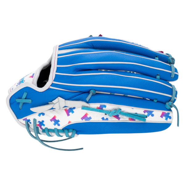 Back view of a blue and white softball glove featuring teal laces and a pattern of multi-colored puzzle pieces on the white leather sections.