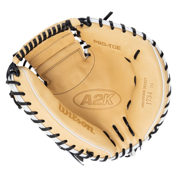 Top-down view of a tan baseball glove with black lacing, featuring "A2K" and "Wilson" logos.