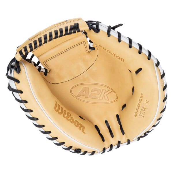 Top-down view of a tan baseball glove with black lacing, showing "A2K" and "Wilson" logos.