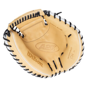 Top-down view of a tan baseball glove with black lacing, showing "A2K" and "Wilson" logos.