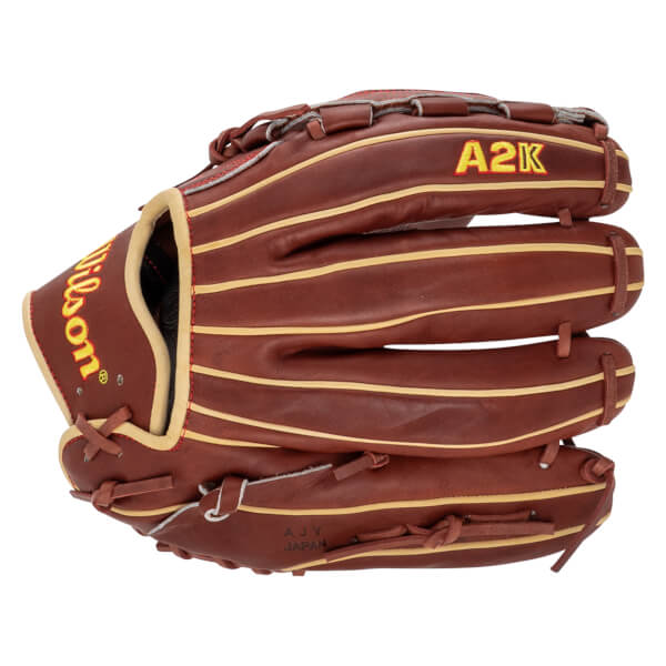 Top-down view of a brown Wilson A2K baseball glove with tan lacing and "AJY JAPAN" stamped on the palm.