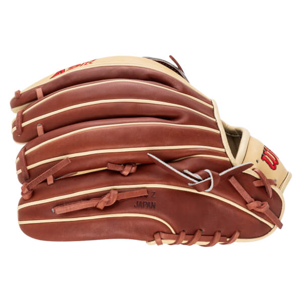 Side view of a brown baseball glove with cream lacing and "JAPAN" stamped on the palm.