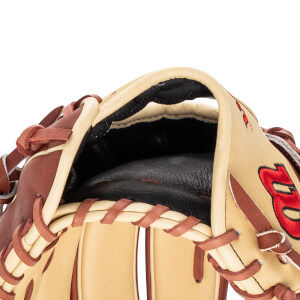 Close-up of a tan baseball glove showing the pocket, brown lacing, and a red embroidered "B".