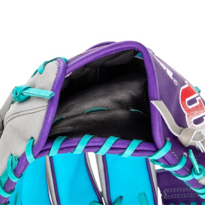 Interior close-up of a purple, grey, and light blue Wilson baseball glove with a black pocket and teal lacing.