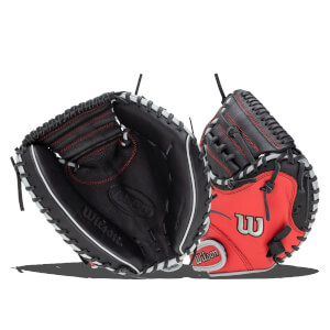 Front view of two baseball gloves, one black with red stitching and white lacing, the other red with a white "W" logo and "Wilson" text.