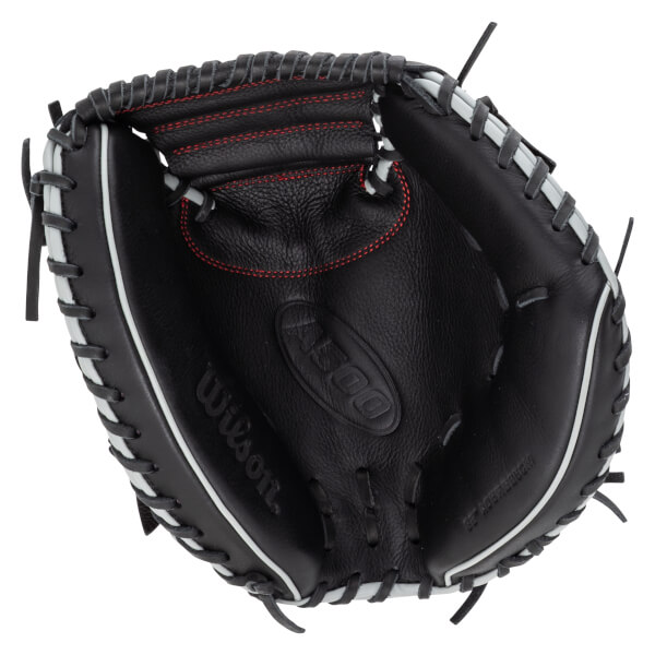 Top-down view of a black baseball glove with white lacing and red stitching, showing the "Wilson" logo and "A500" detail.