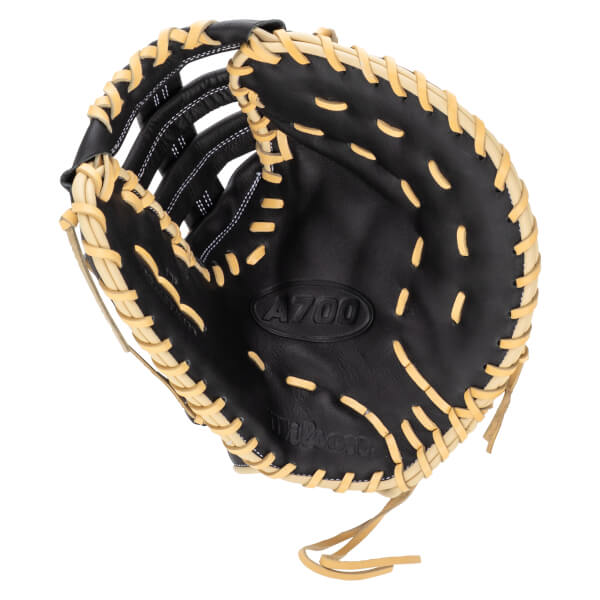 Top-down view of a black Wilson A700 baseball glove with tan lacing and white stitching.