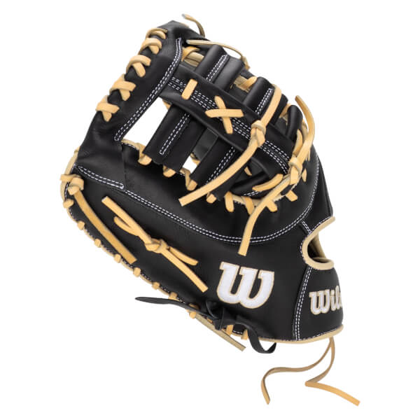 Side view of a black baseball glove with tan lacing and white stitching, featuring a white "W" logo.