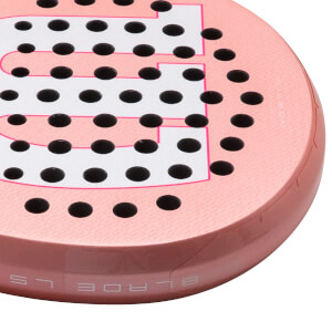 Corner view of a rose gold padel racket with black holes and pink trim, showing the "BLADE LS" text.