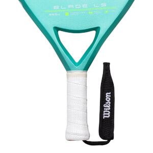 Close-up of a teal paddle showing "BLADE LS" and a white grip with "Wilson" on the wrist strap.