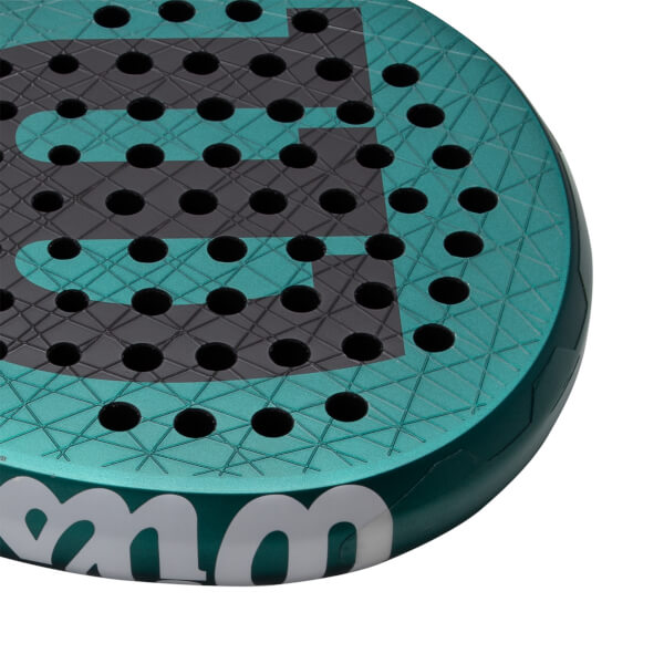 Close-up of the top right of a teal padel racket with a textured face, round holes, and dark gray W logo.