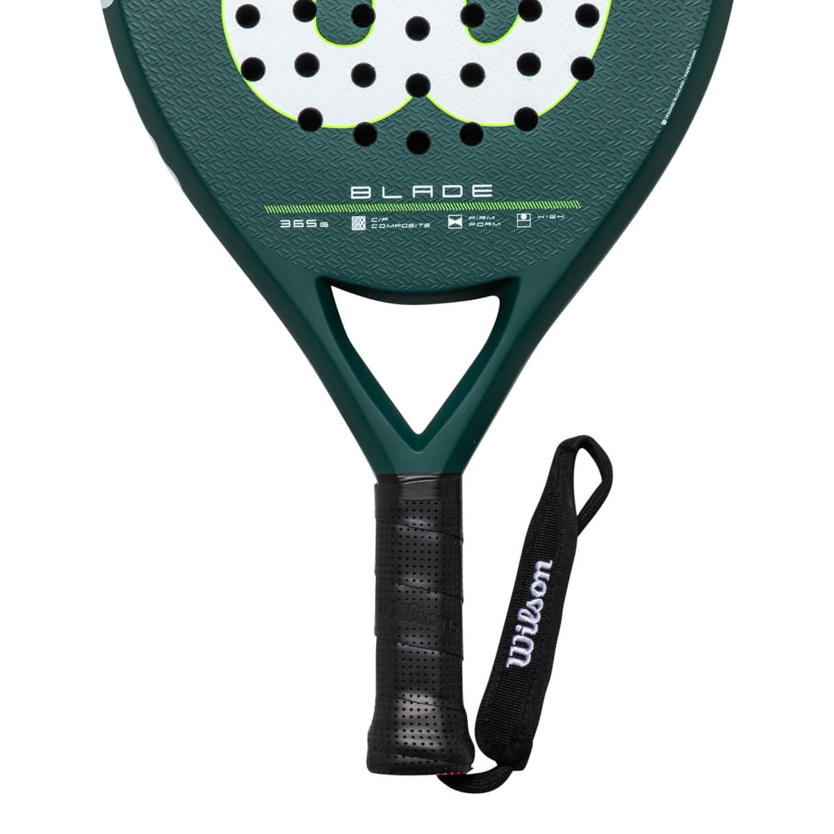 Close-up of the handle and lower head of a green Wilson Blade paddle, showing the black grip and wrist strap with "Wilson" text.