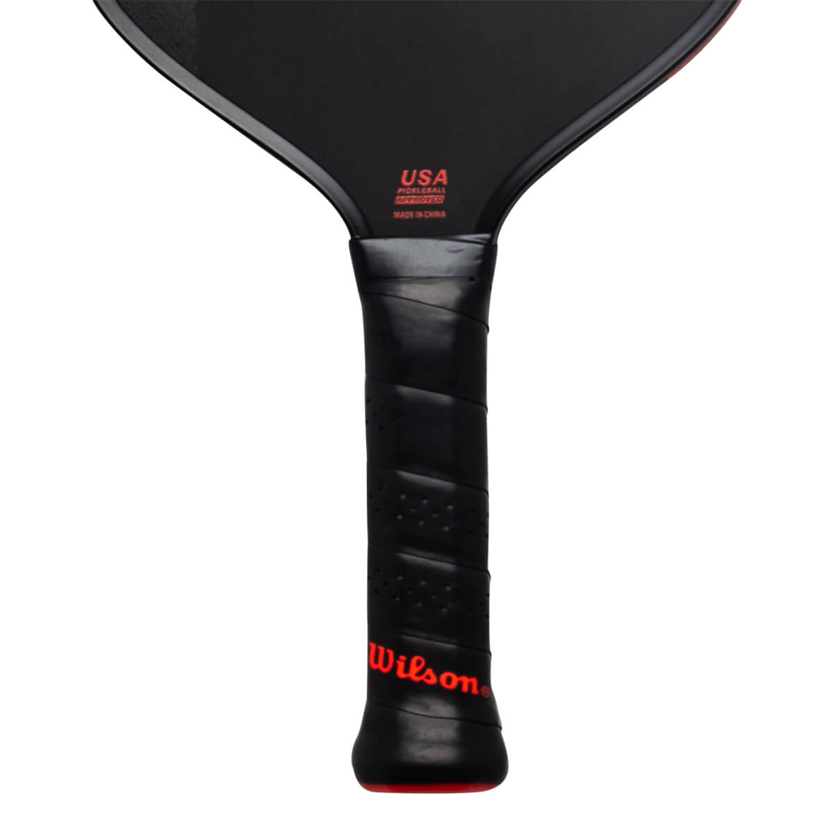 Close-up of the black handle and lower face featuring a red Wilson logo and red text stating USA PICKLEBALL APPROVED and MADE IN CHINA.