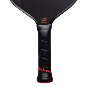 Close-up of the black handle and lower face featuring a red Wilson logo and red text stating USA PICKLEBALL APPROVED and MADE IN CHINA.
