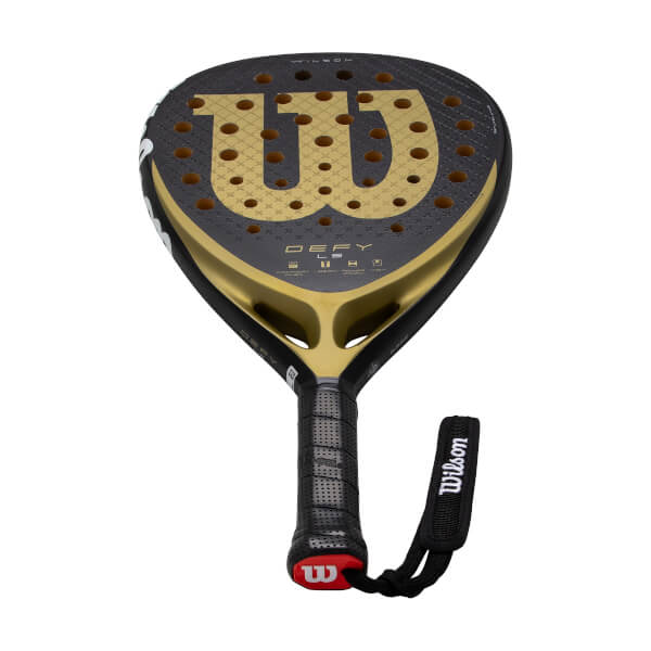 Front view of a black and gold padel racket with a large gold W logo and DEFY LS text.