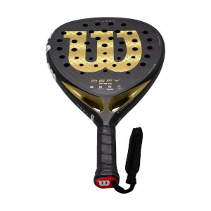 Angled front view of a black and gold padel racket with a large gold W, DEFY PRO text, and perforated face.