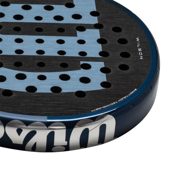Corner view of a blue and black Wilson paddle with "WILSON" and "EXACTTOUCH TECHNOLOGY" visible.