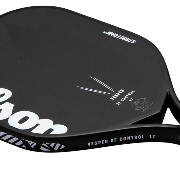 Angled close-up of a matte black paddle face and edge featuring a large white logo and text reading "VESPER SF CONTROL 17" and "STRIKEFOAM".