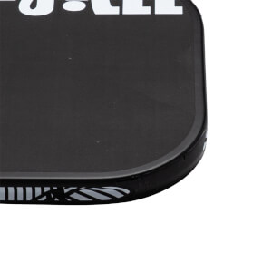 Close-up corner view of a black pickleball paddle featuring a rounded edge guard and bold white lettering along the top.