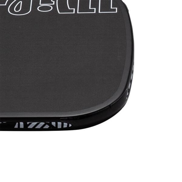 Close-up corner view of a black pickleball paddle featuring a textured surface with a white JOOLA logo outline and a patterned black edge guard.