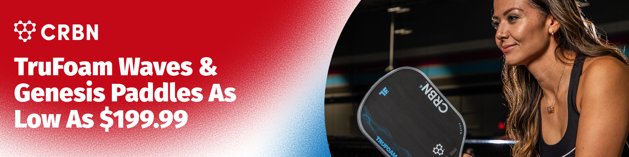 CRBN TruFoam Waves & Genesis Paddles As Low As $199.99. A woman holds a CRBN paddle.